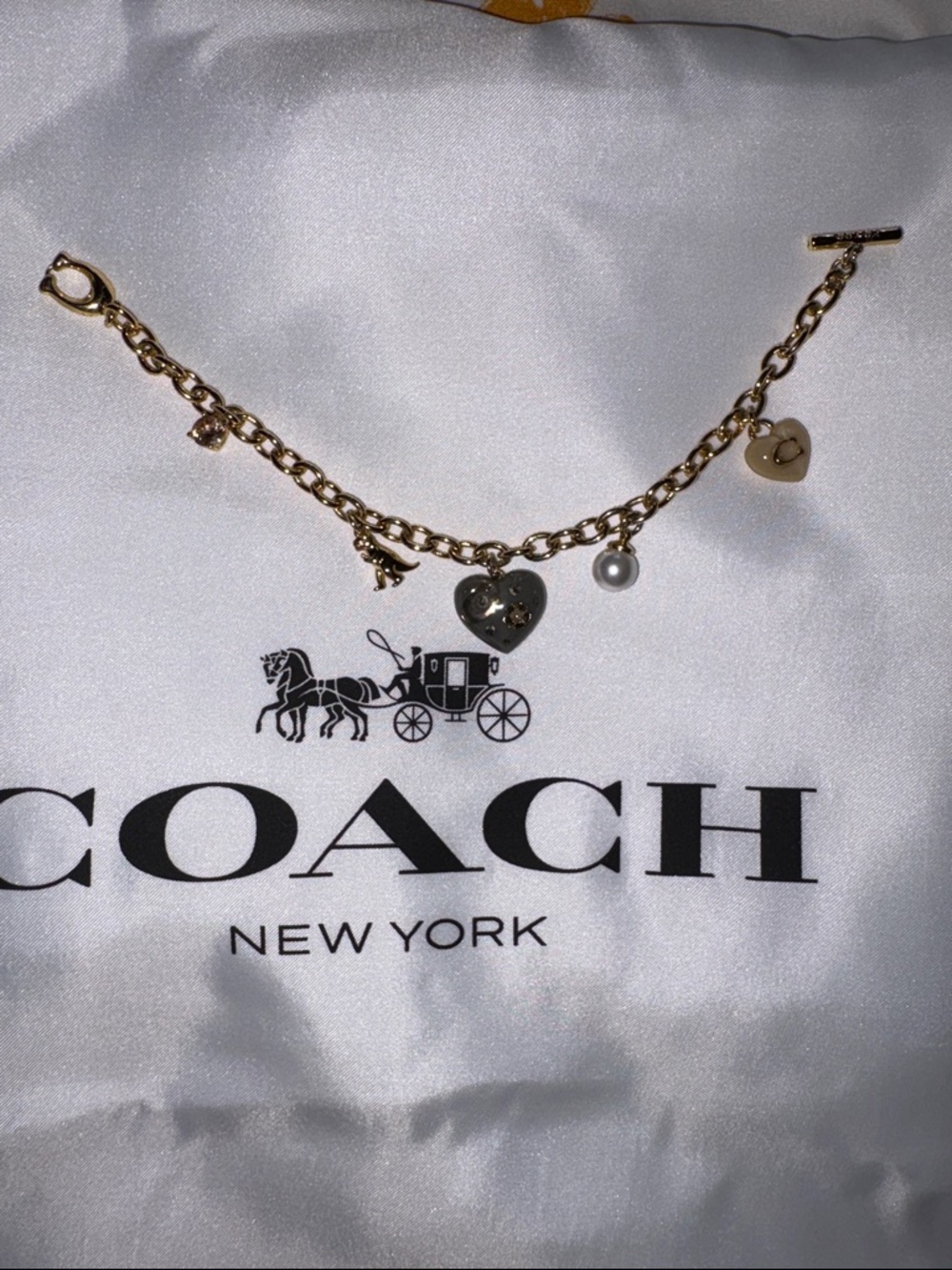 Coach Gold-Tone Charm Bracelet with Black Heart, Gold Heart & Pearl